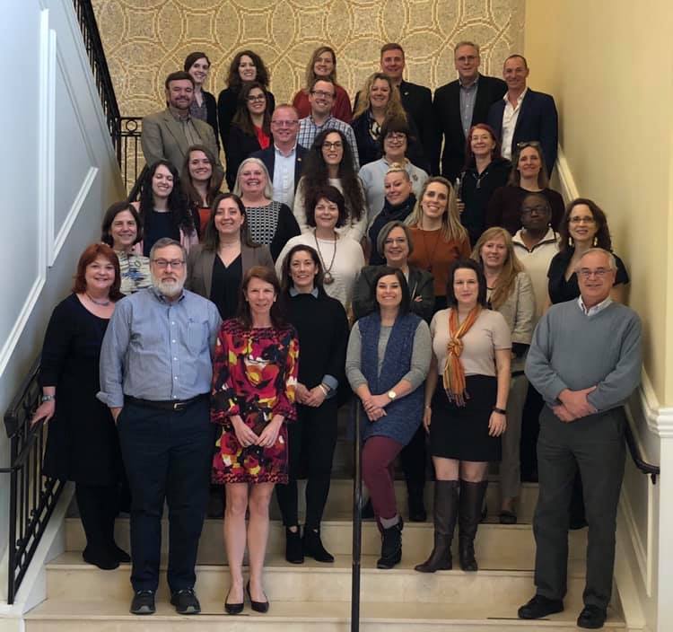 A picture of the SEMC2019 Program committee. Photographed in a stairway as everyone smiles at the camera.